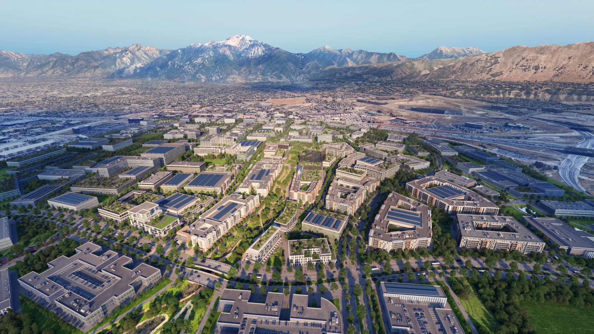Aerial rendering of The Point district in Draper, with buildings, green spaces and the Wasatch Mountains
